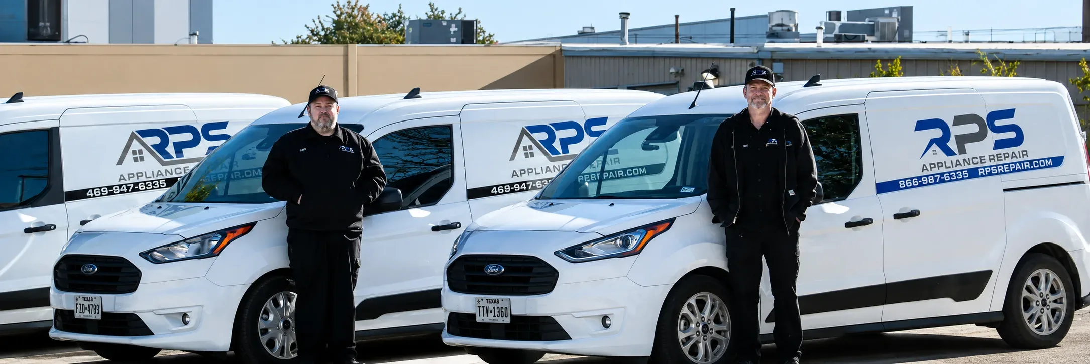Two RPS Appliance Repair technicians standing with service vans at the Texas office